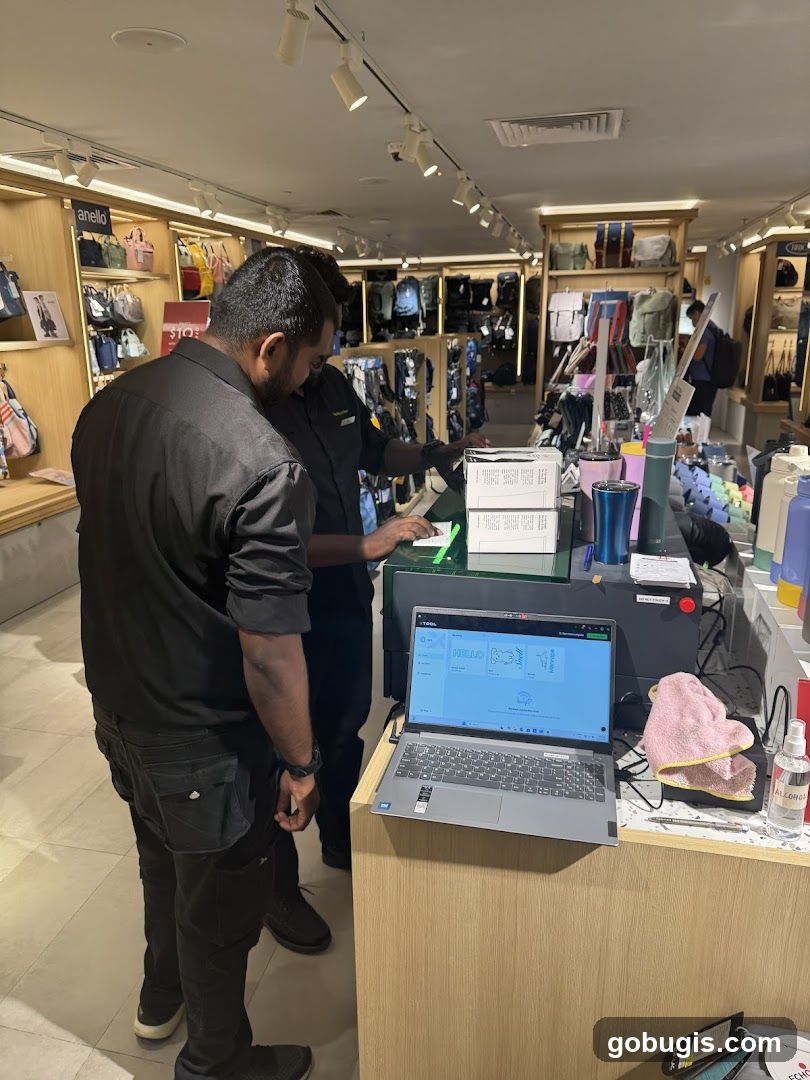 Store Interior with Staff and Laptop