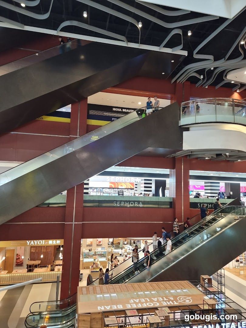 Mall Interior with Escalators and Shops