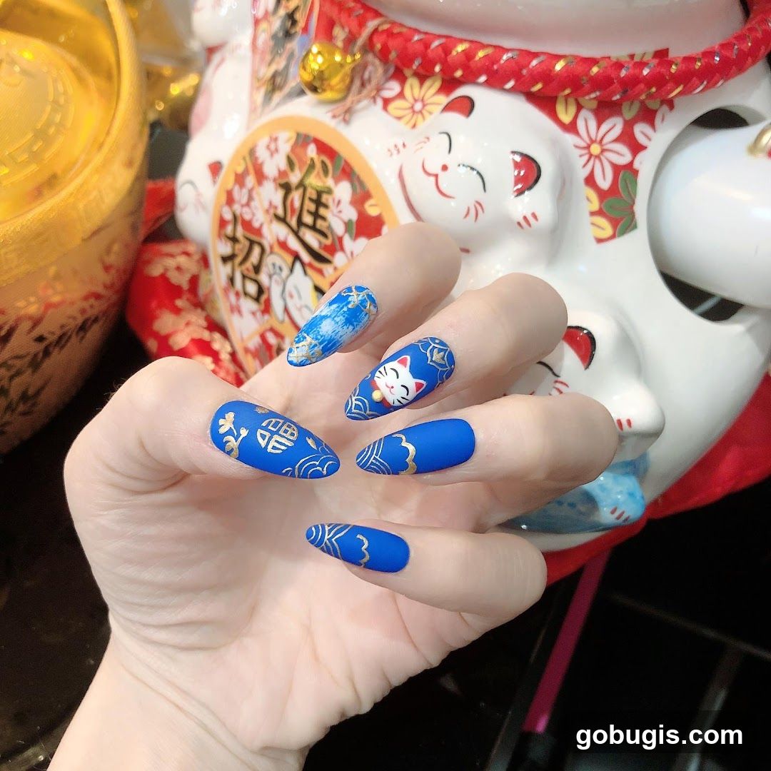 Manicured Hand with Themed Nails