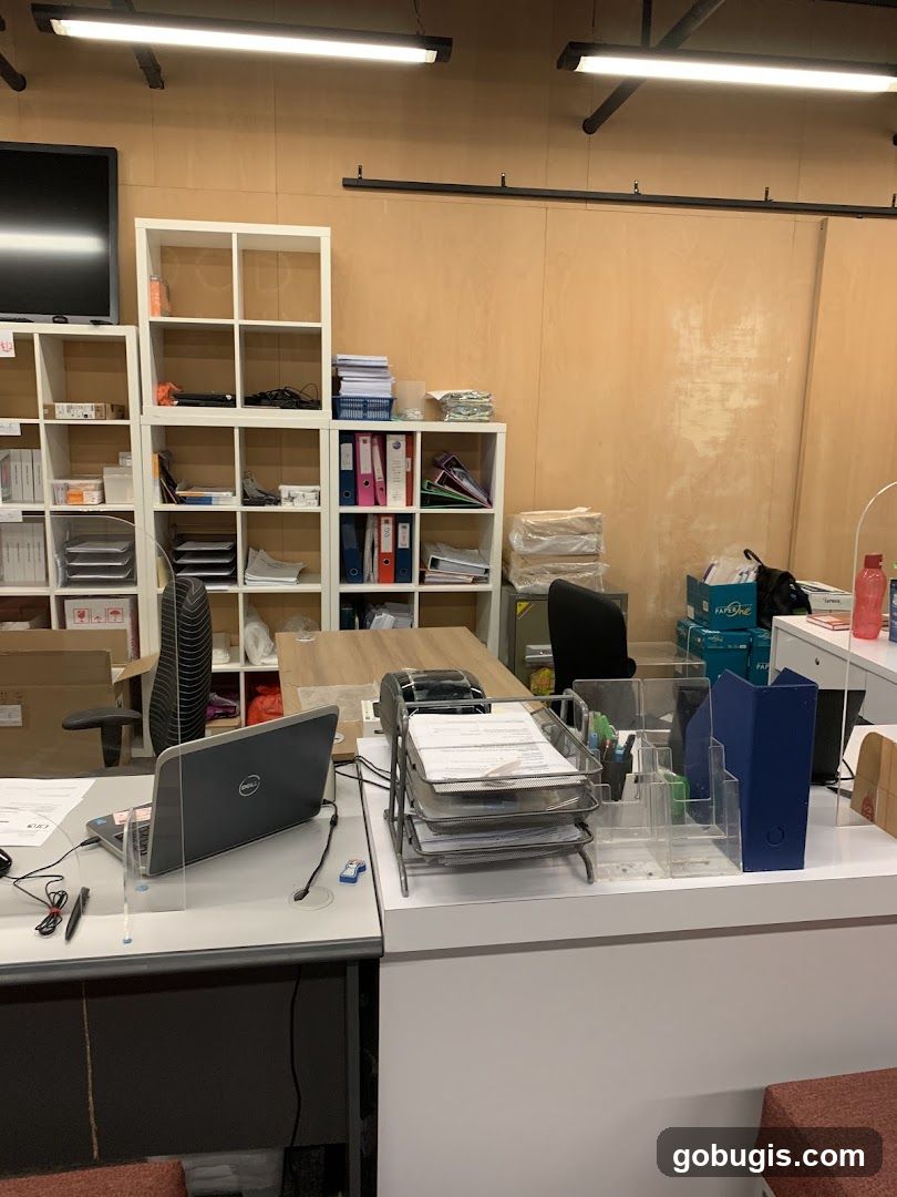 Office Desk with Laptop and Shelving
