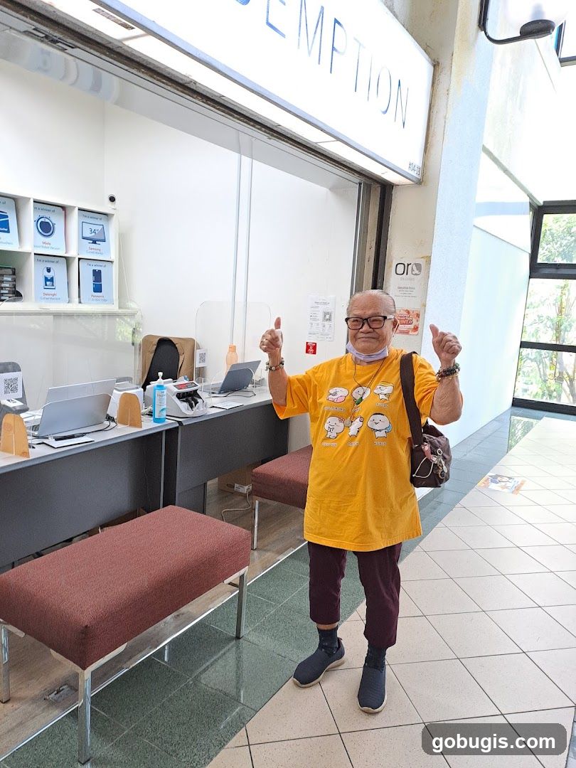 Man giving thumbs up in front of a shop