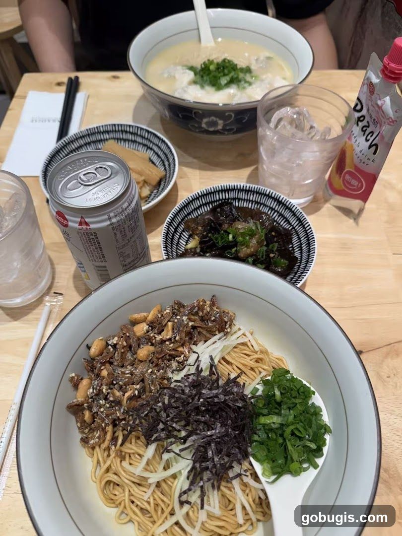 Noodle Dish with Sides and Drink