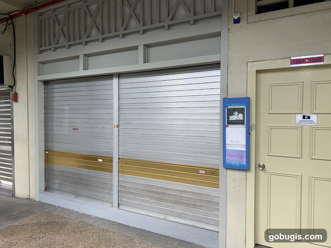 Shopfront with Roller Shutters and Notice Board