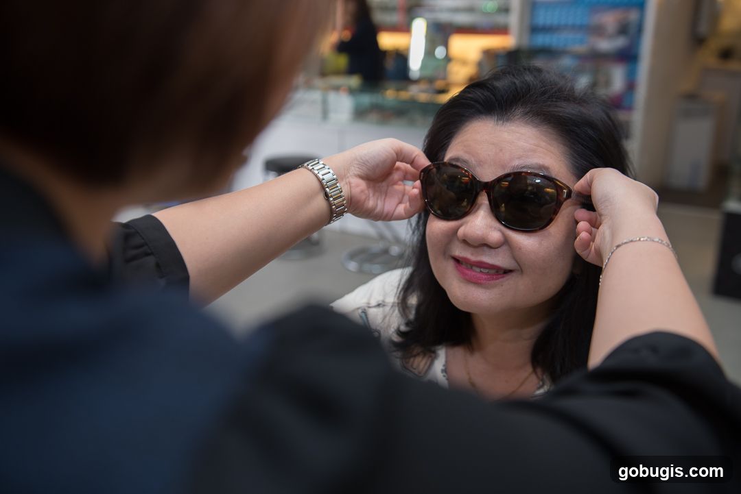 Customer Tries on Sunglasses