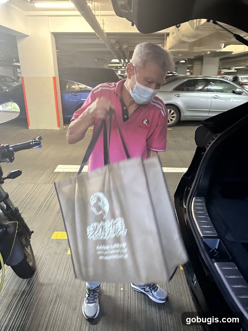 Man loading groceries into car