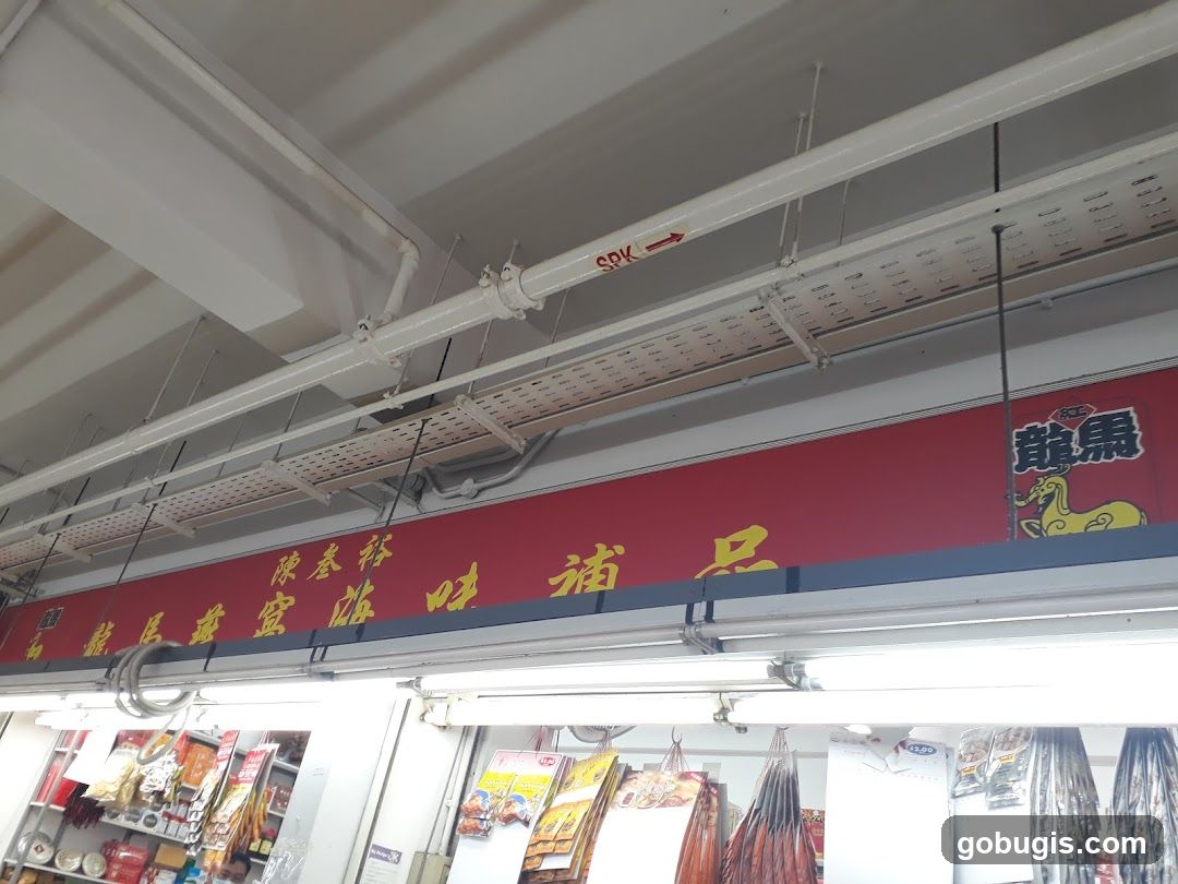 Red Sign with Chinese Characters and Yellow Dragon Logo