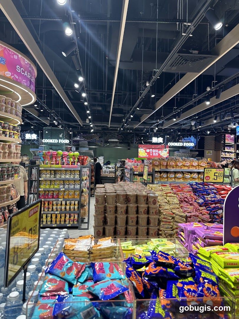 Supermarket aisle with snacks and instant noodles
