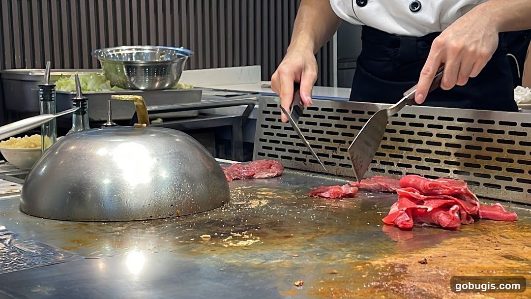 Chef cooking meat on a grill