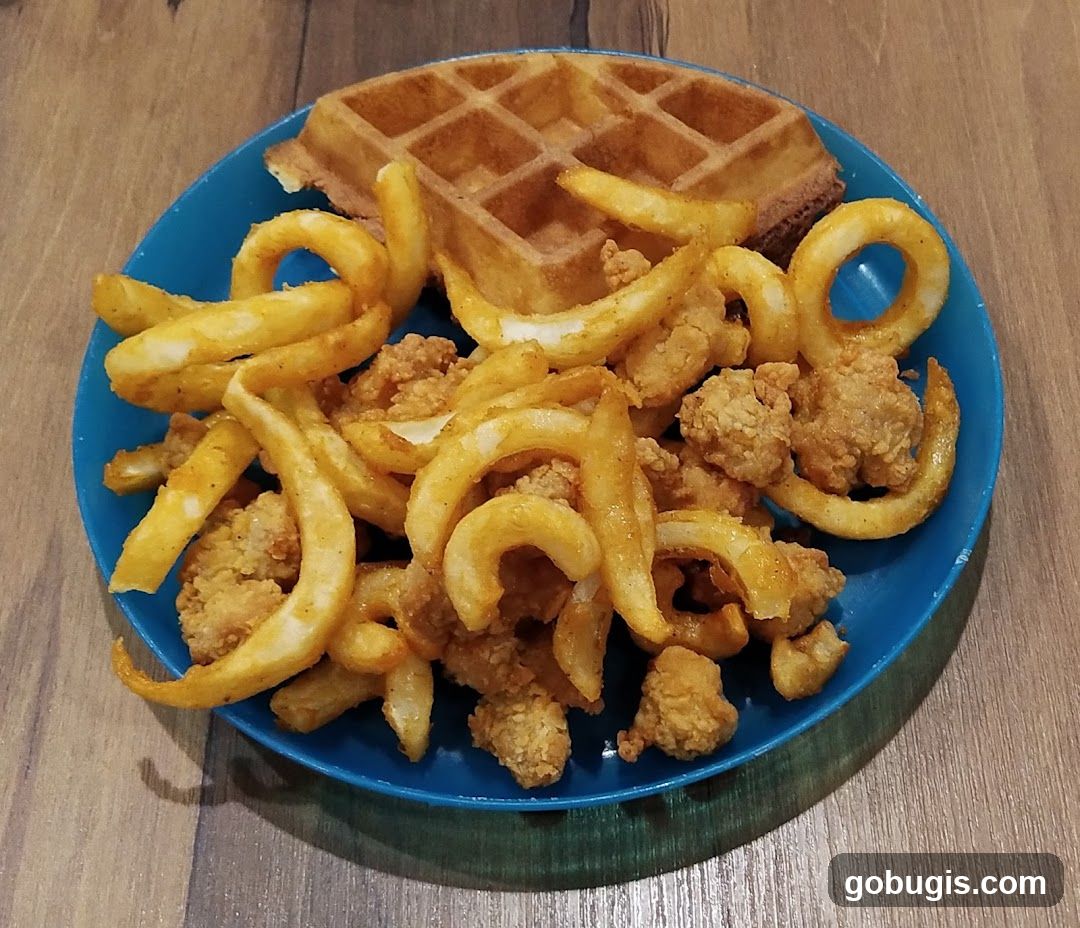 Waffle with Fried Chicken and Curly Fries