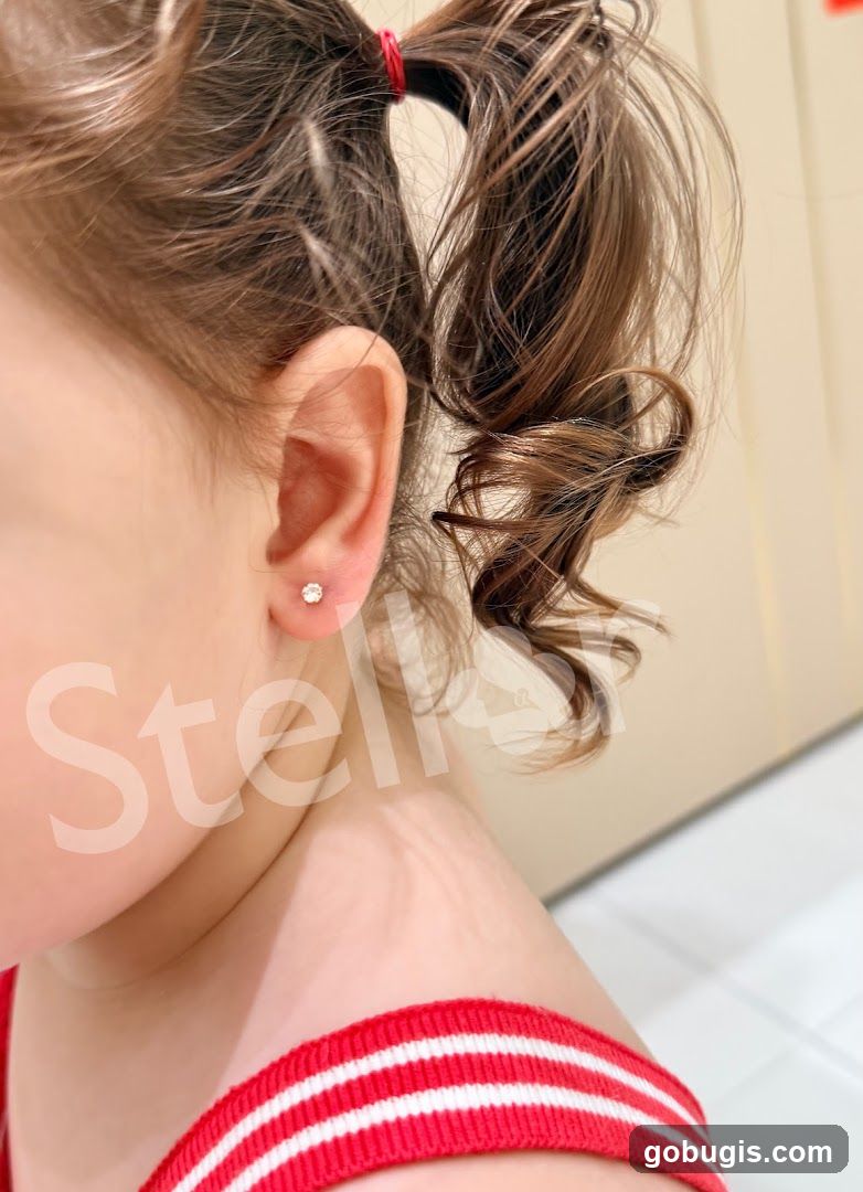 Child Wearing Diamond Stud Earrings