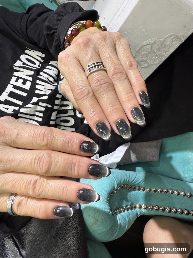 Woman's Hands with Cat Eye Nails