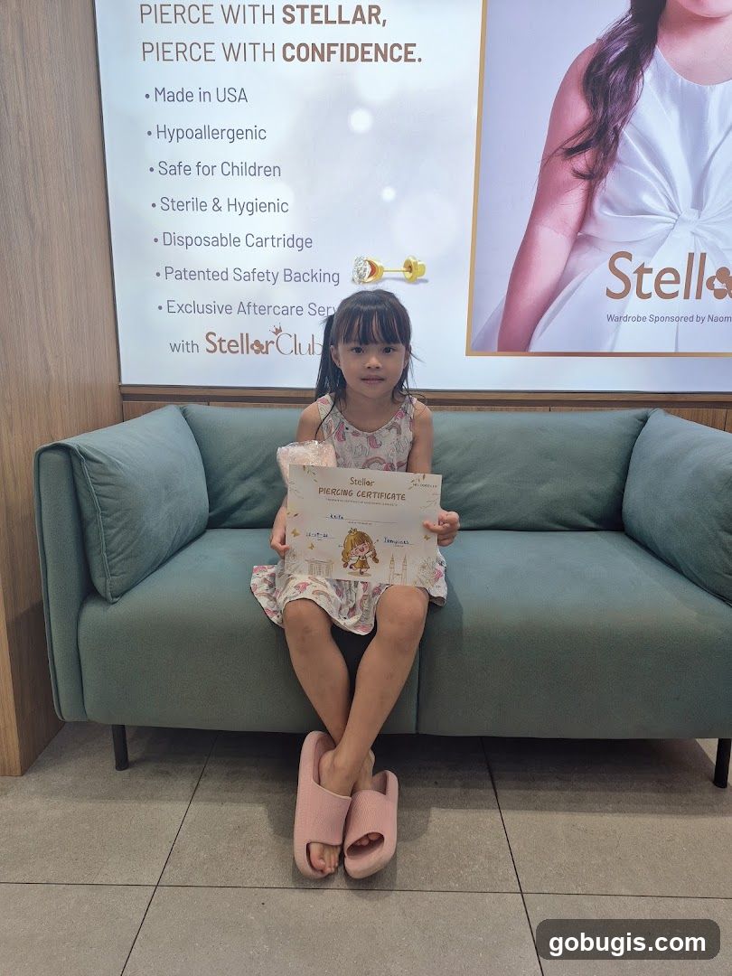 Girl holding a piercing certificate