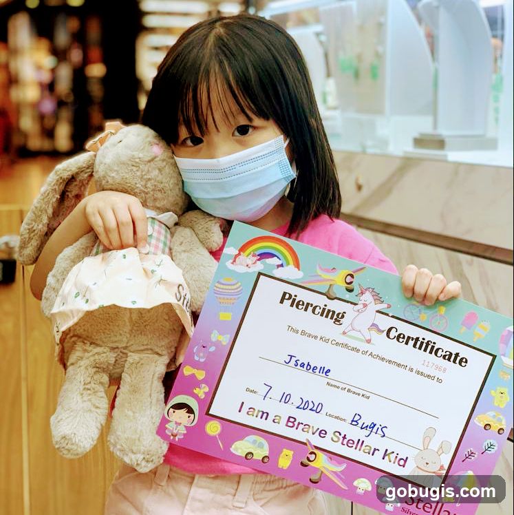 Girl with a "Brave Kid" Certificate