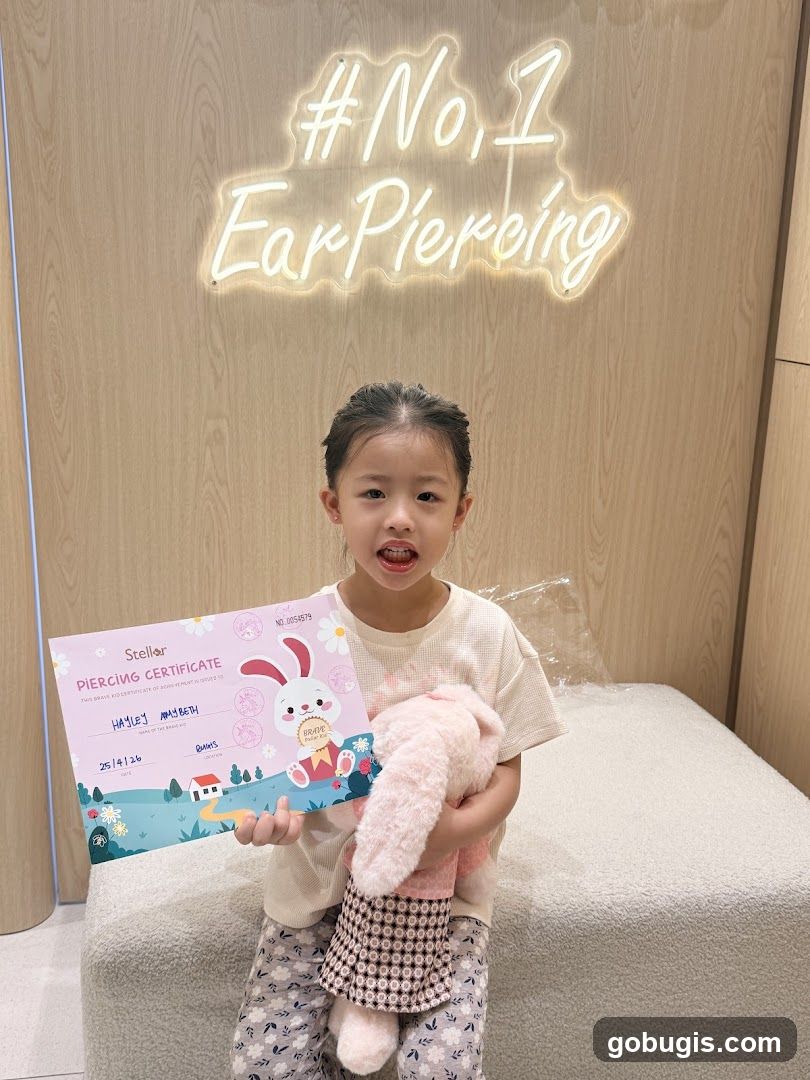 Girl Holding a Piercing Certificate