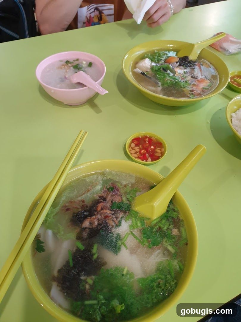 Table with bowls of soup and congee