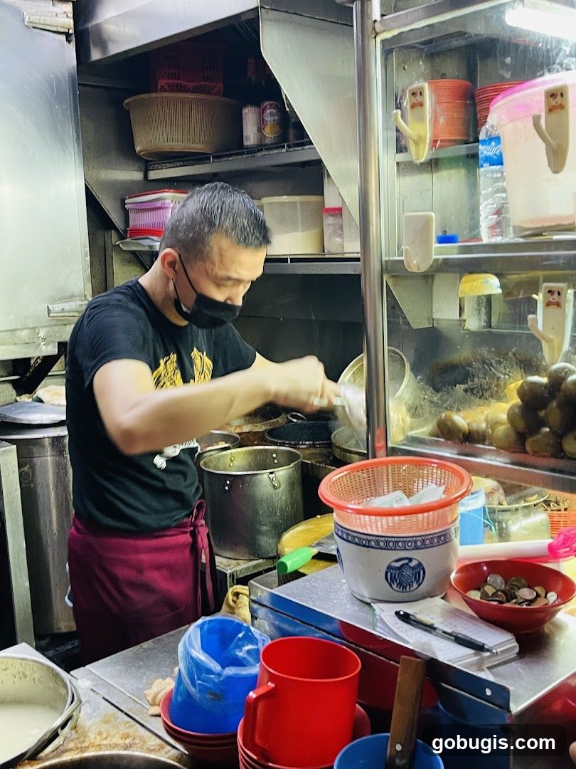 Food stall worker preparing food