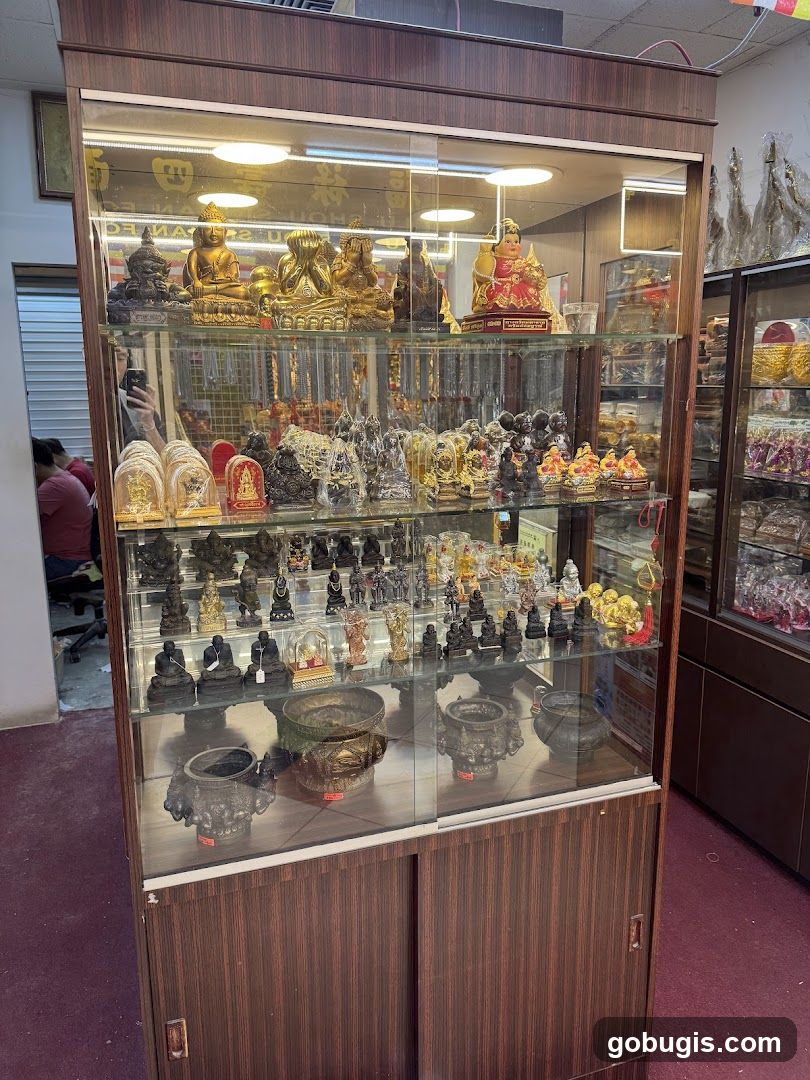 Display Cabinet with Religious Statues and Incense Burners