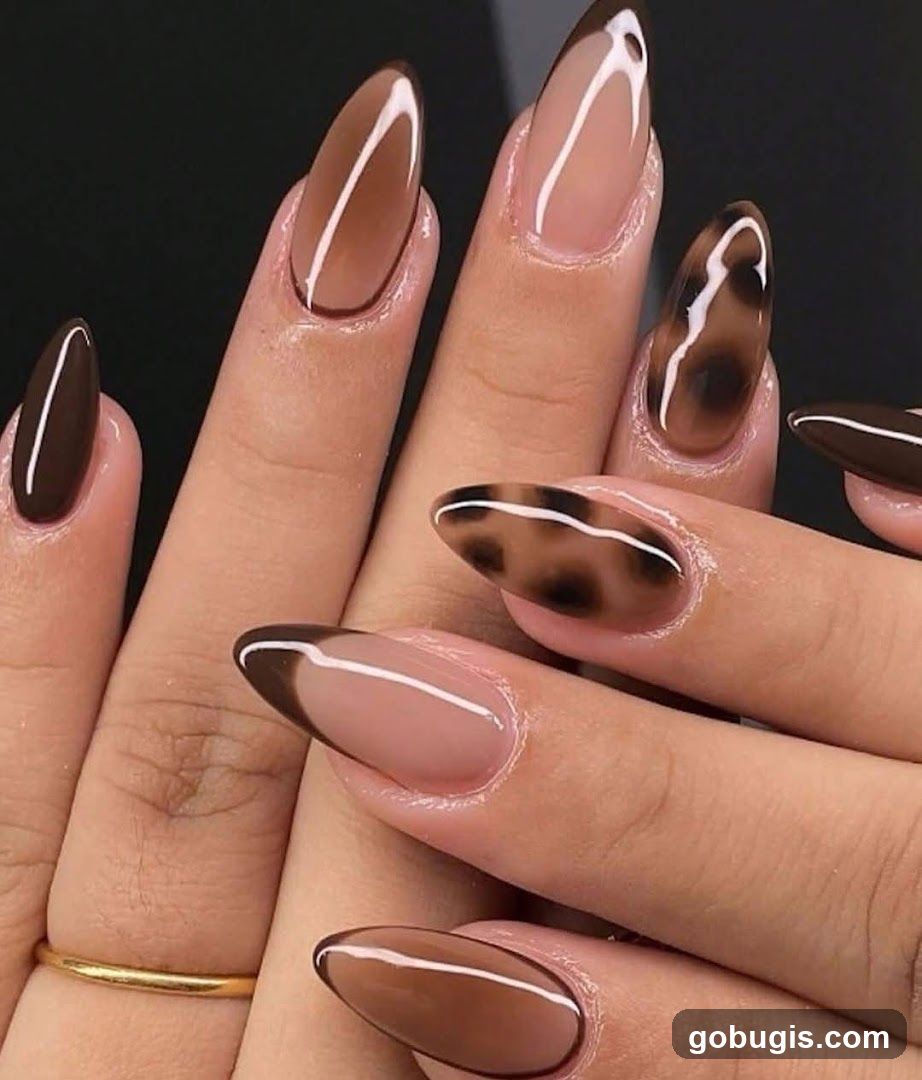 Almond-shaped nails with brown and leopard print design