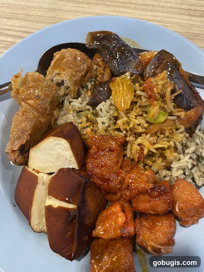Plate of Rice with Various Toppings