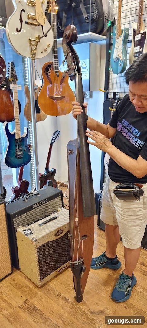 Man holding a cello