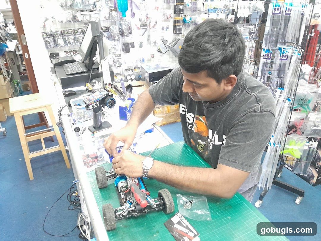 Man assembling a remote-controlled car