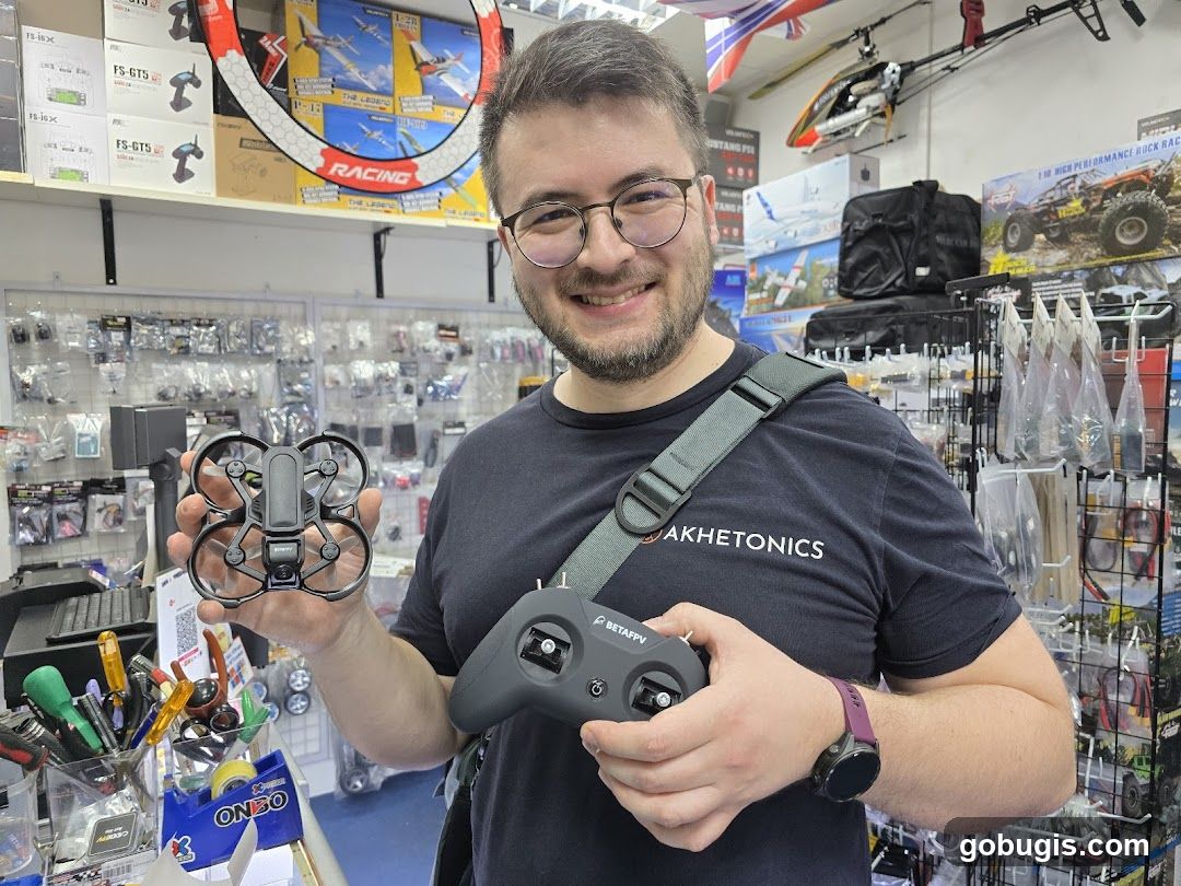 Man holding a drone and controller
