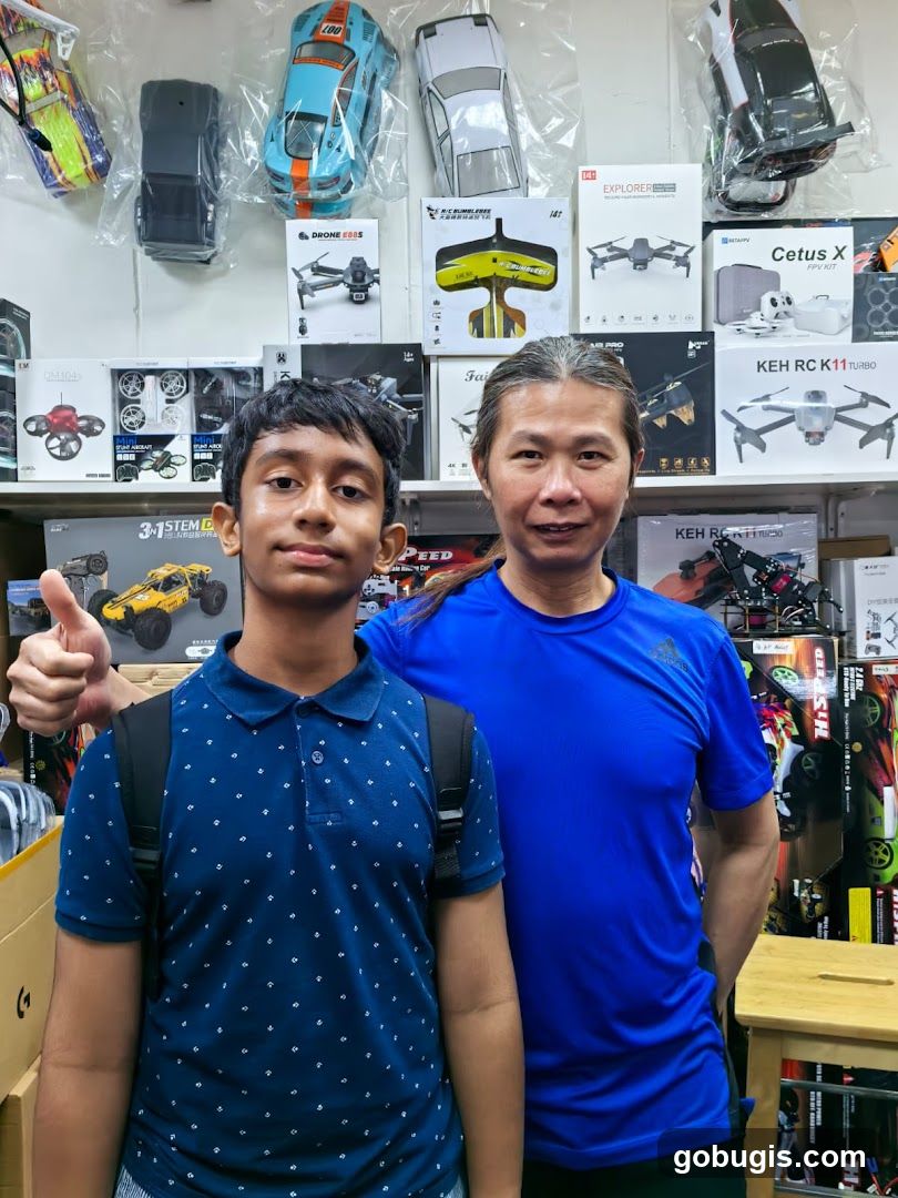 Two people in a store selling drones and remote-controlled vehicles