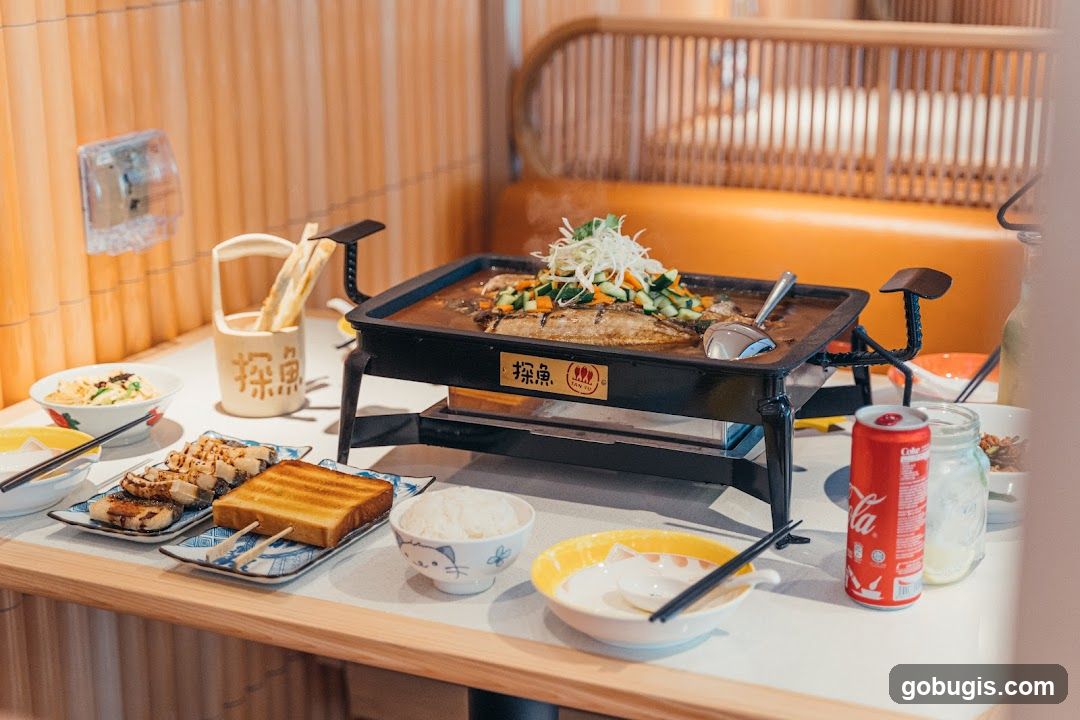Table with Grilled Fish and Sides