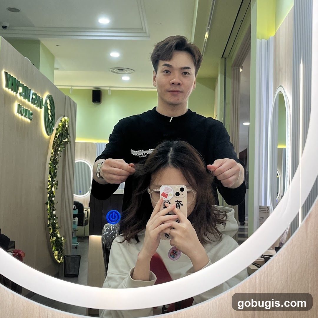 Hairdresser styling client's hair