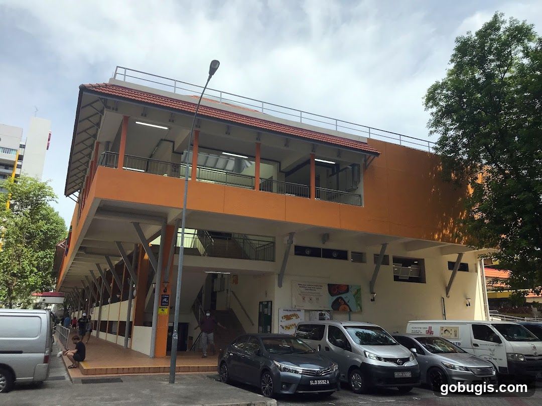 Outdoor view of a multi-level building with orange accents