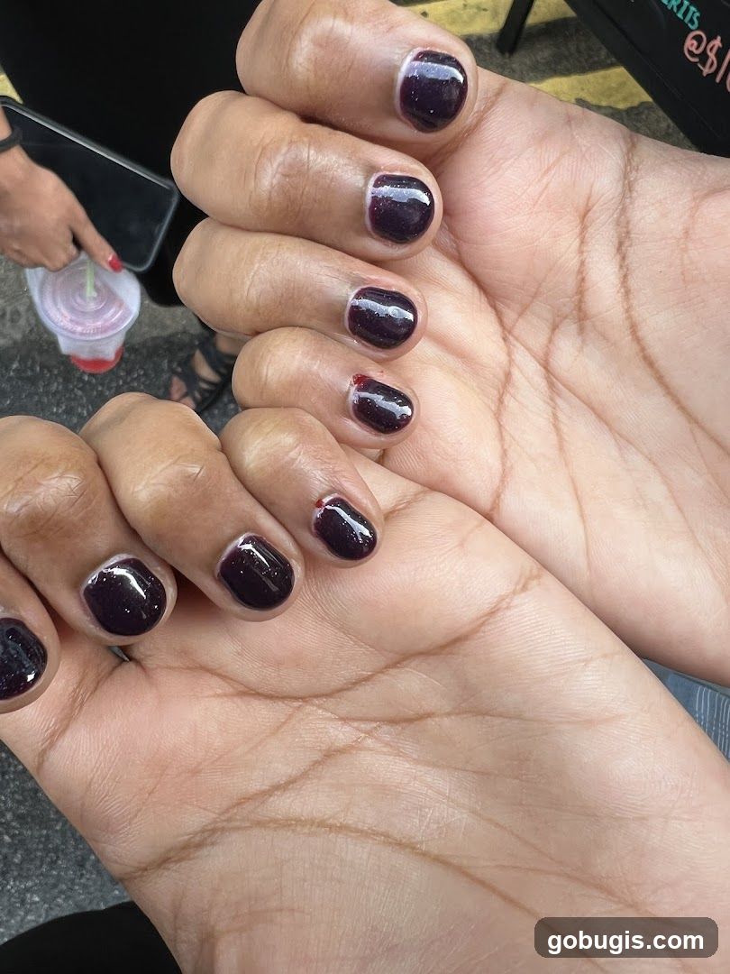Hands with Dark Nail Polish