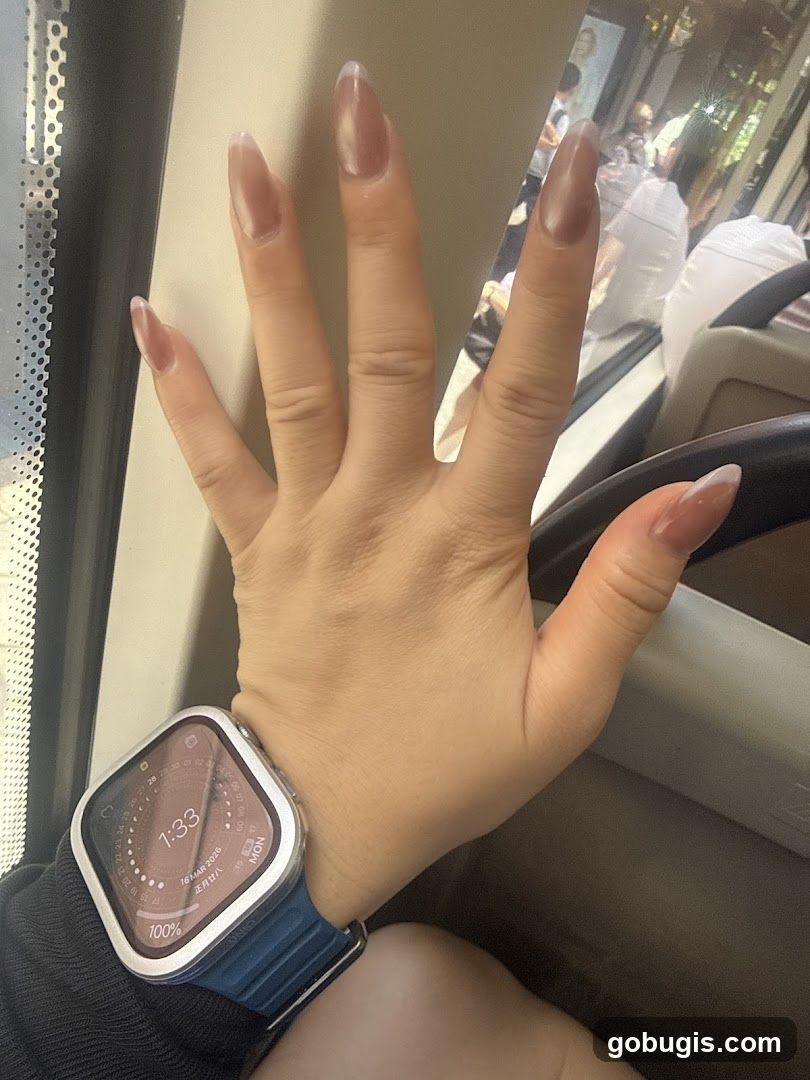 Hand with Watch and Nails