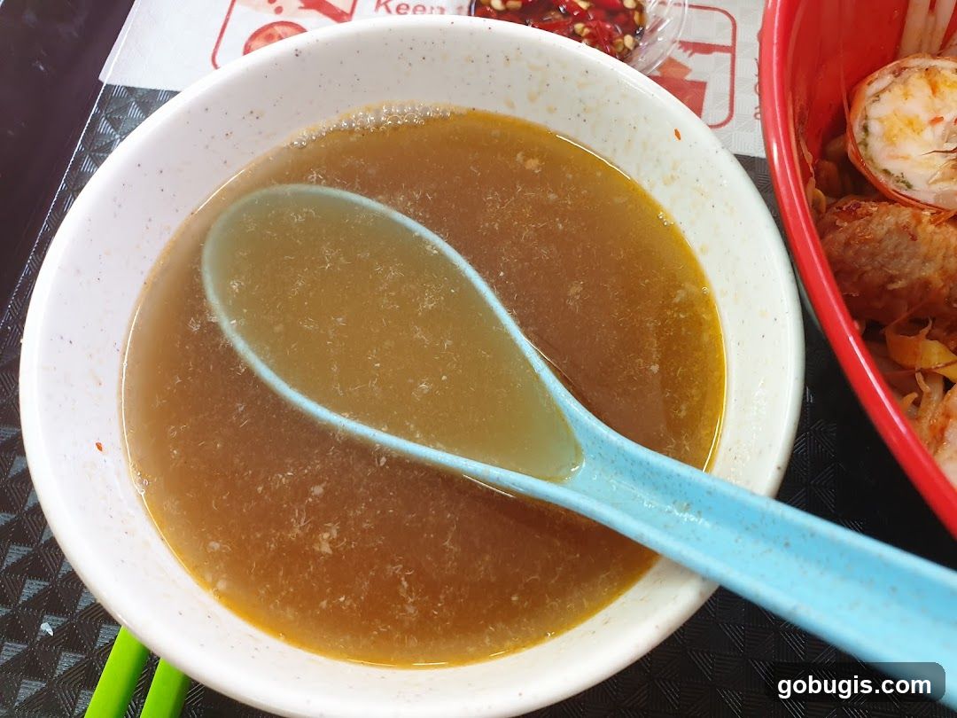 Bowl of Broth with Spoon