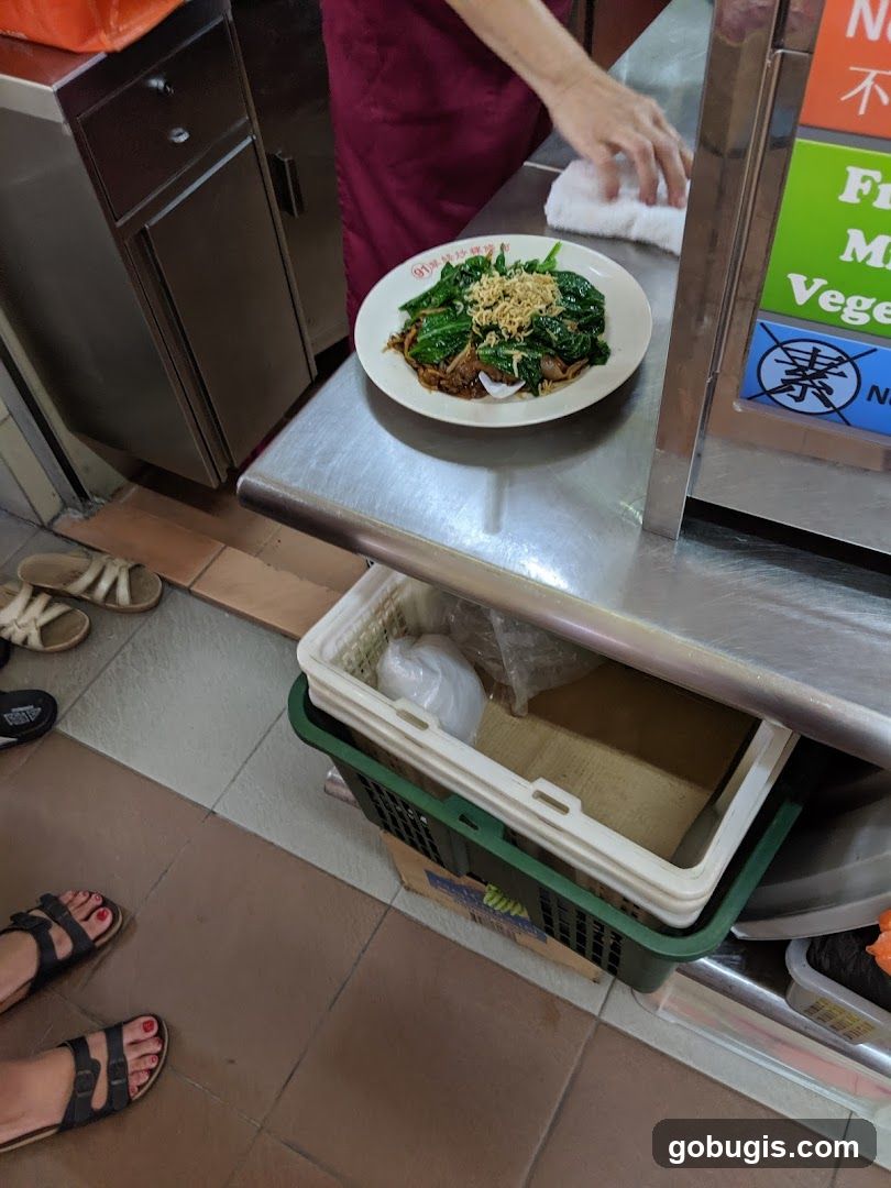 Food stall counter with a plate of noodles