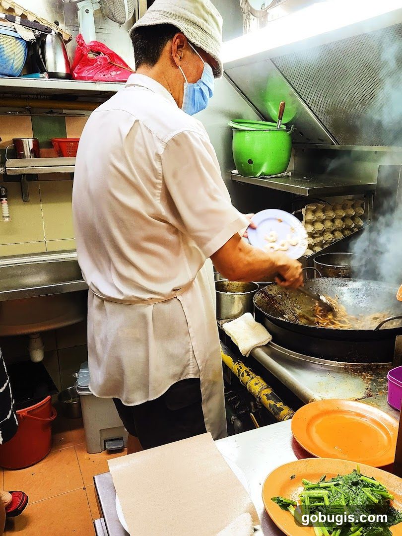 Cook preparing food in a kitchen