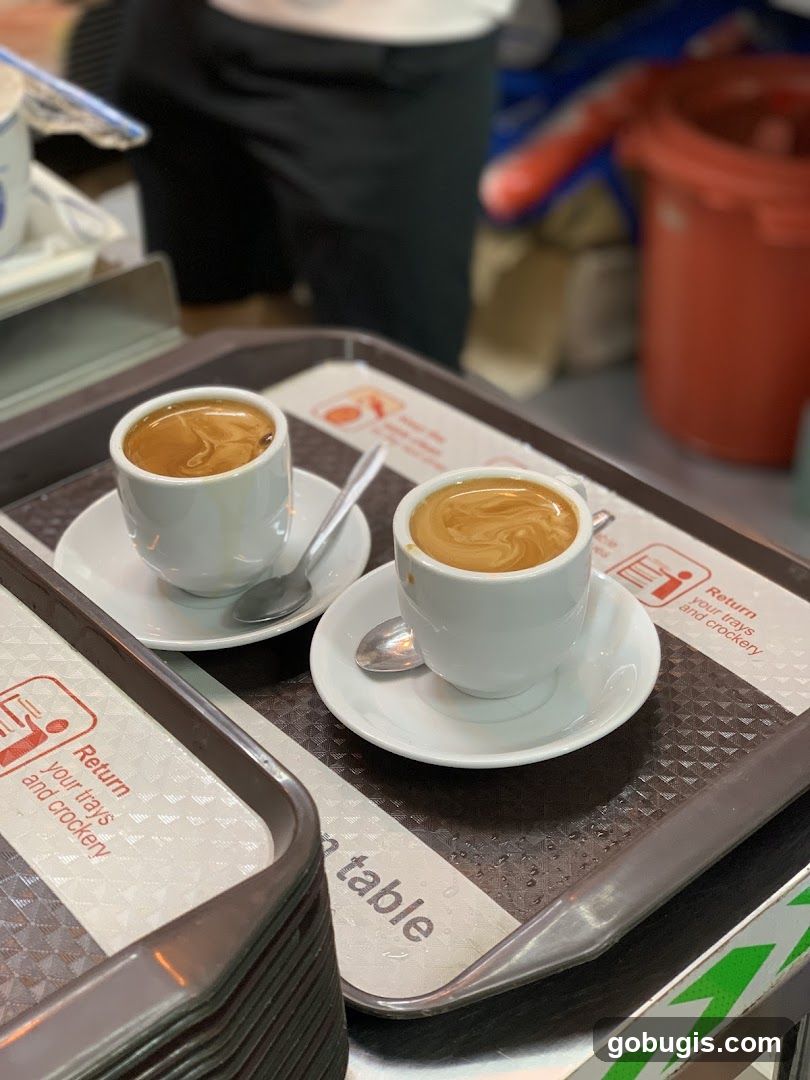 Two cups of espresso on a tray
