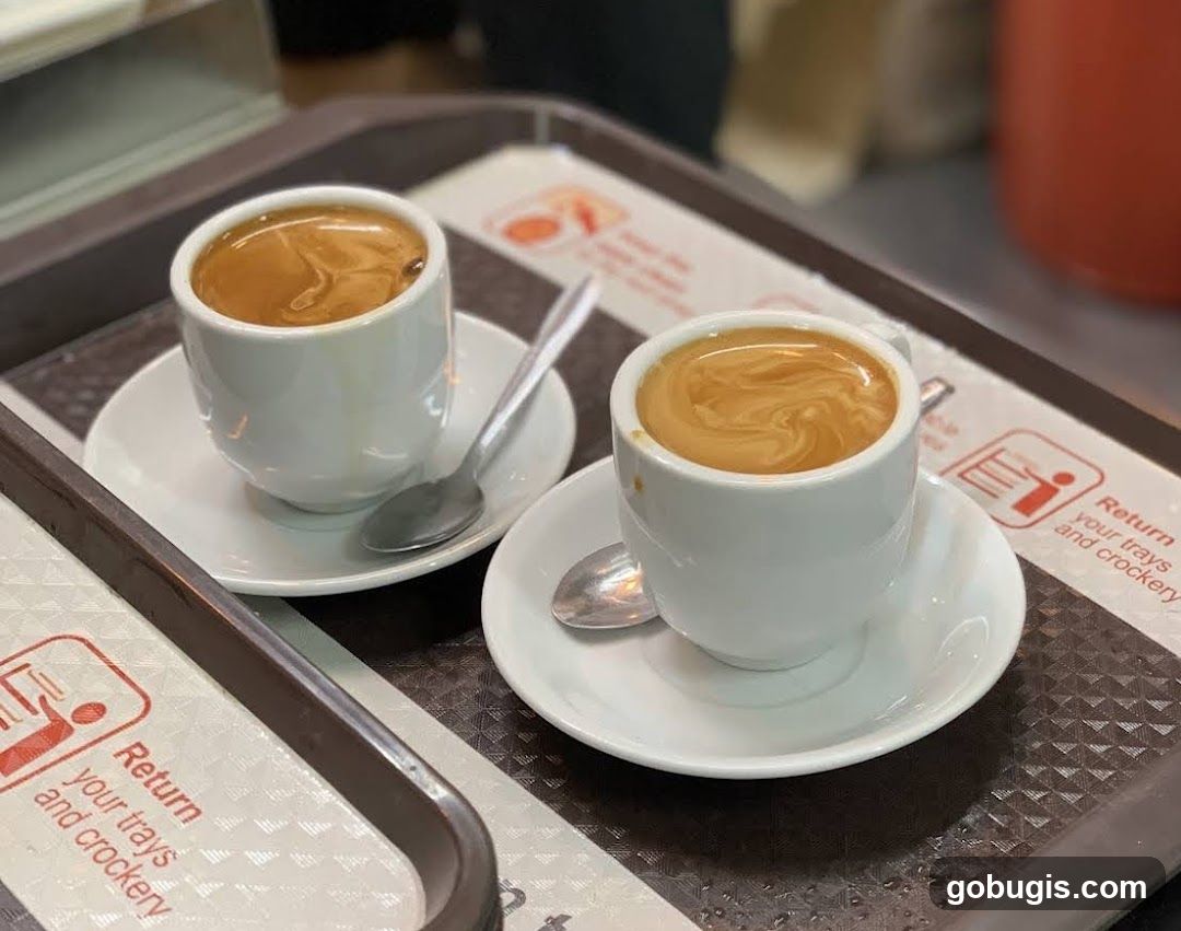 Two cups of coffee on a tray