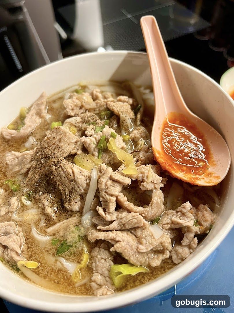 Bowl of Noodles with Meat and Chili Sauce