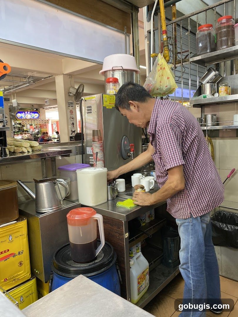 Man preparing drinks at a stall