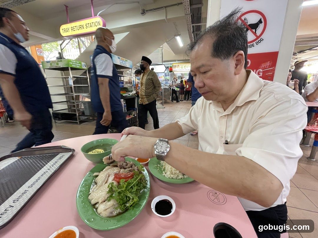 Man Eating Chicken Rice