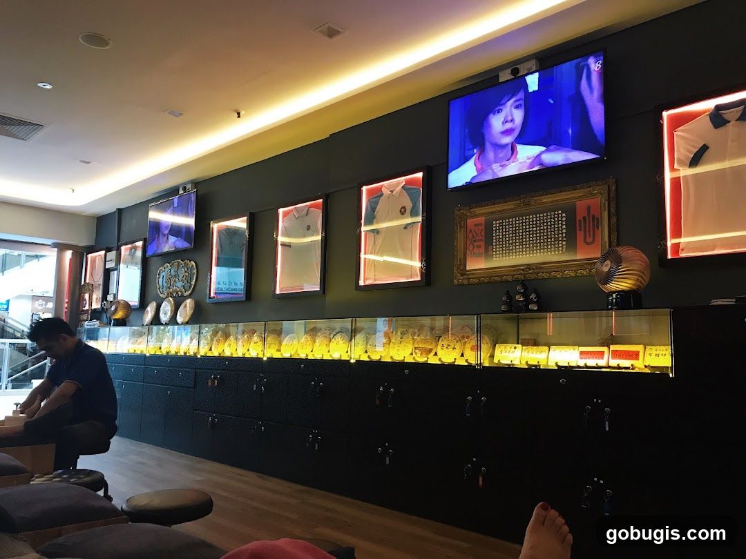 Interior of a shop with display cases and televisions