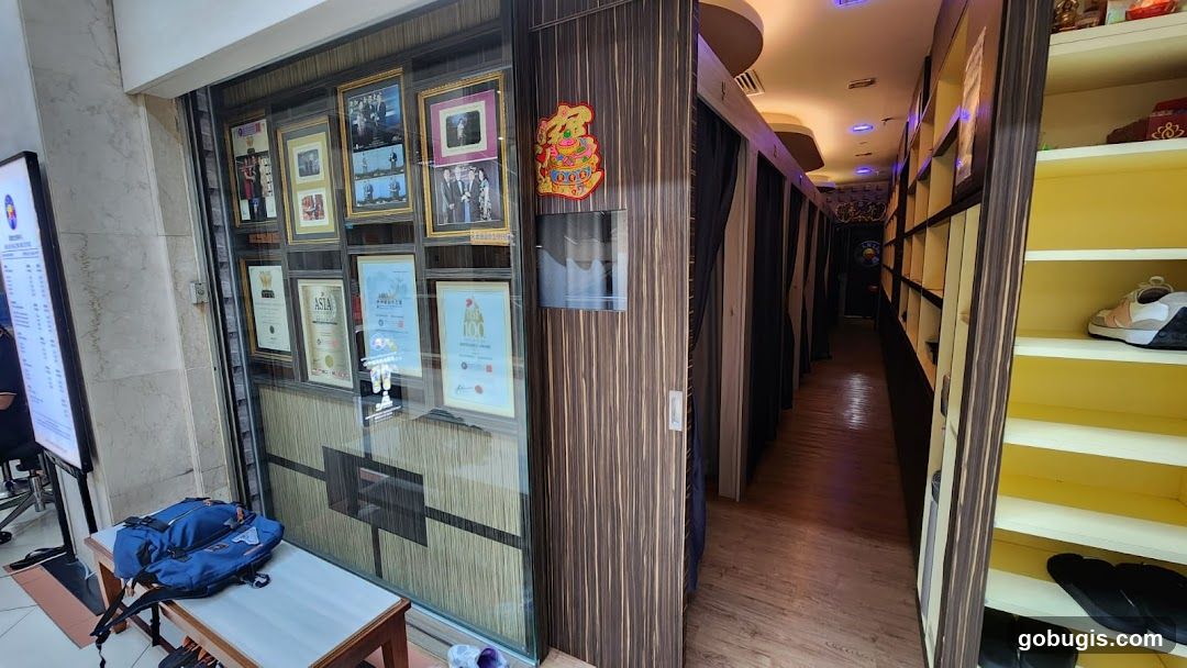 Interior of a business with framed certificates and shelves