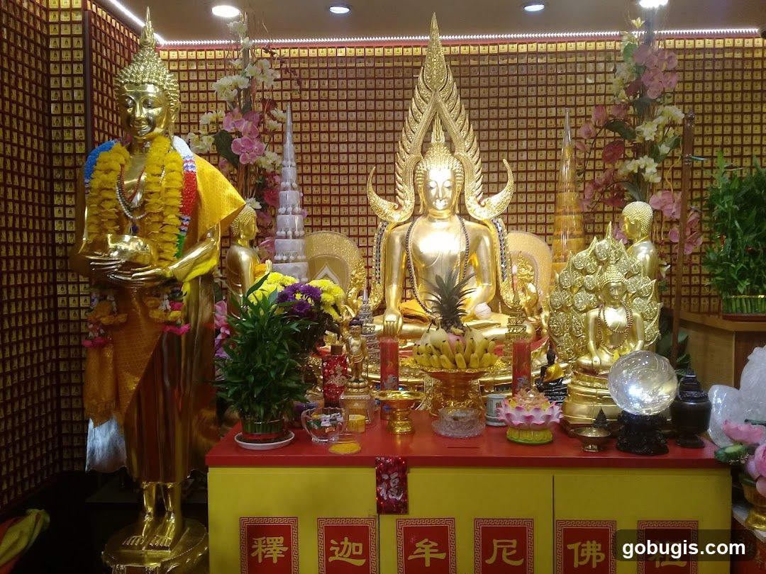 Buddhist Altar with Statues and Offerings