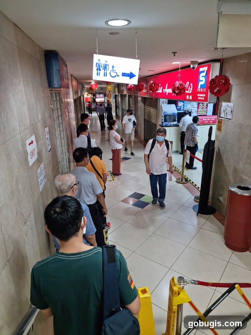 People queuing in a hallway