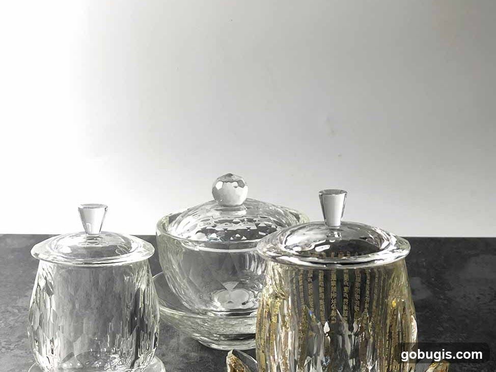 Three decorative glass jars