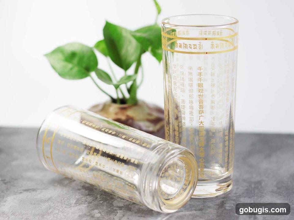 Two glasses with gold text