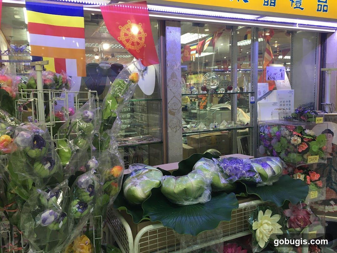 Buddhist flags and artificial flowers