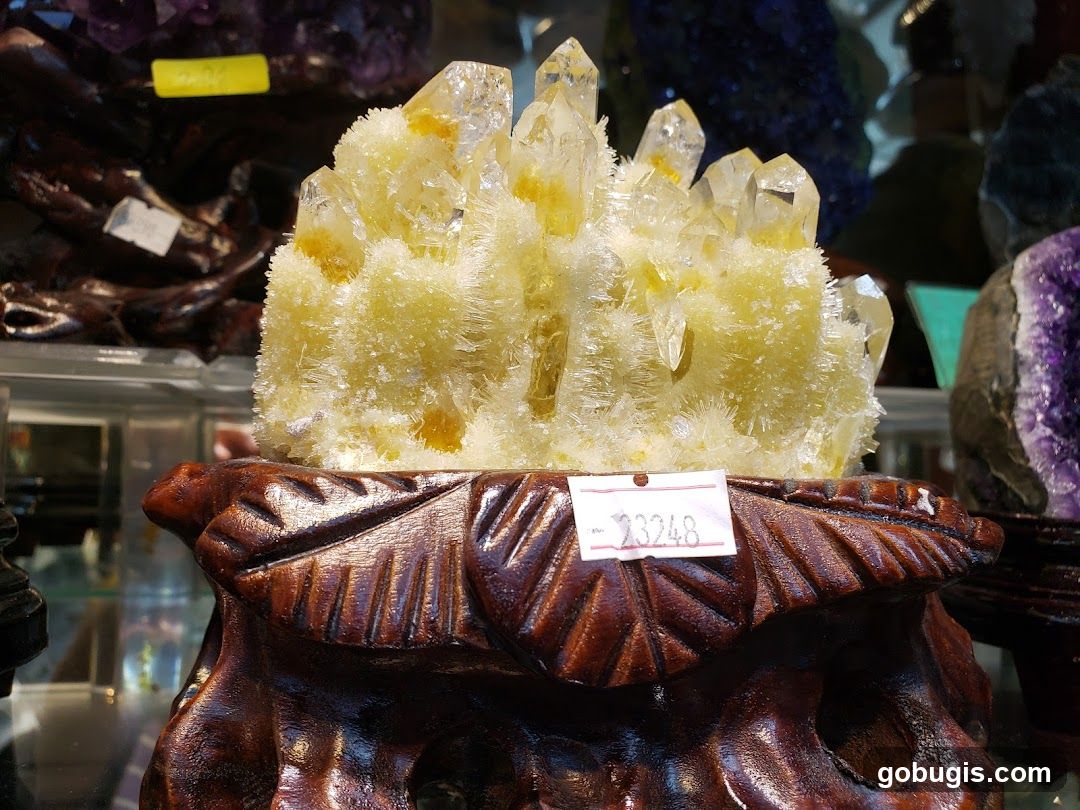 Crystal cluster on wooden stand