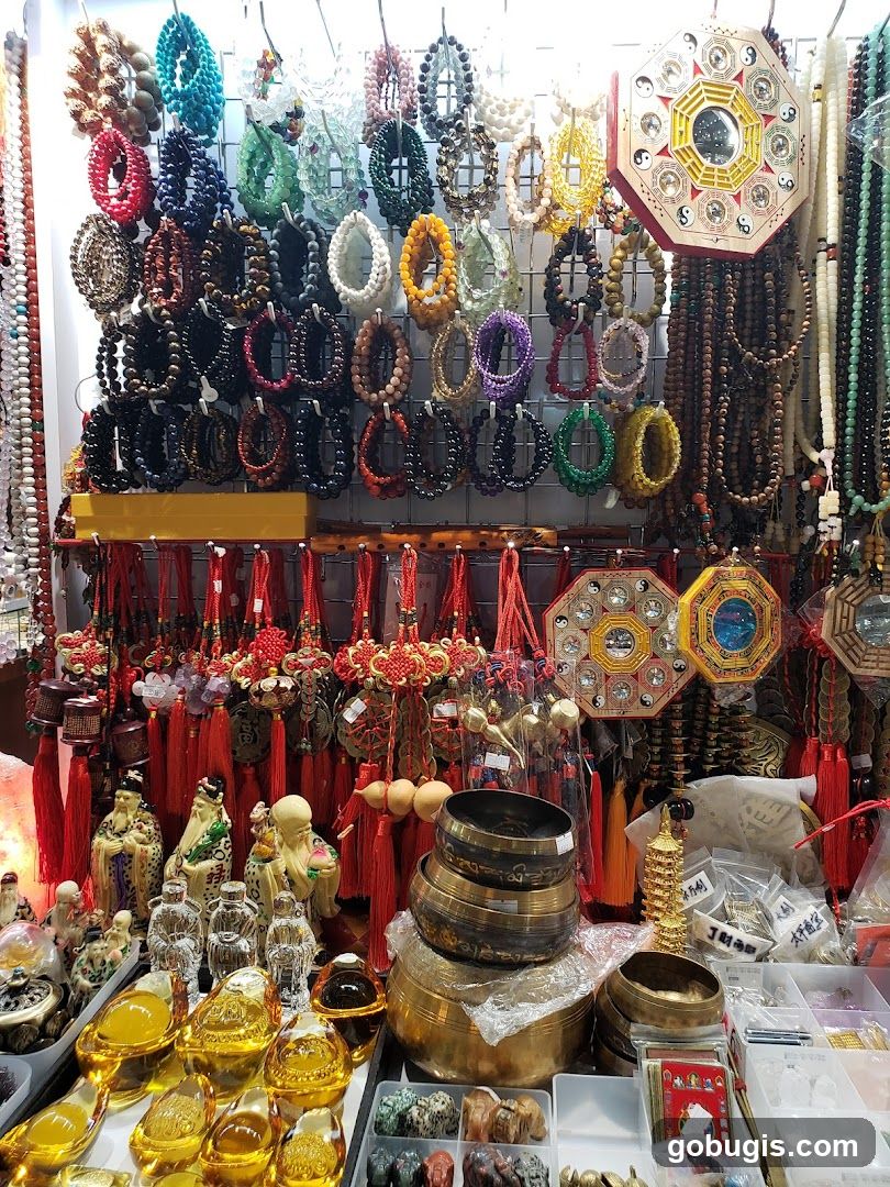 Assortment of Bracelets, Charms, and Statuettes