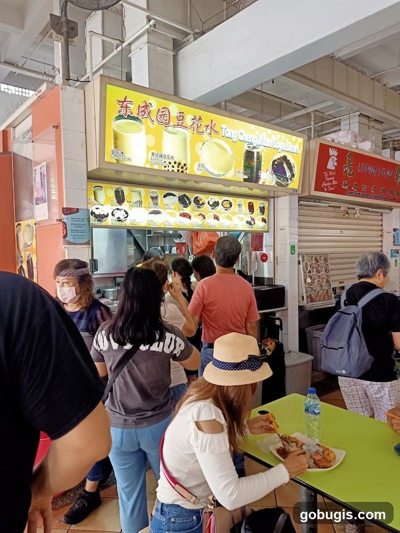 People queuing at a food stall